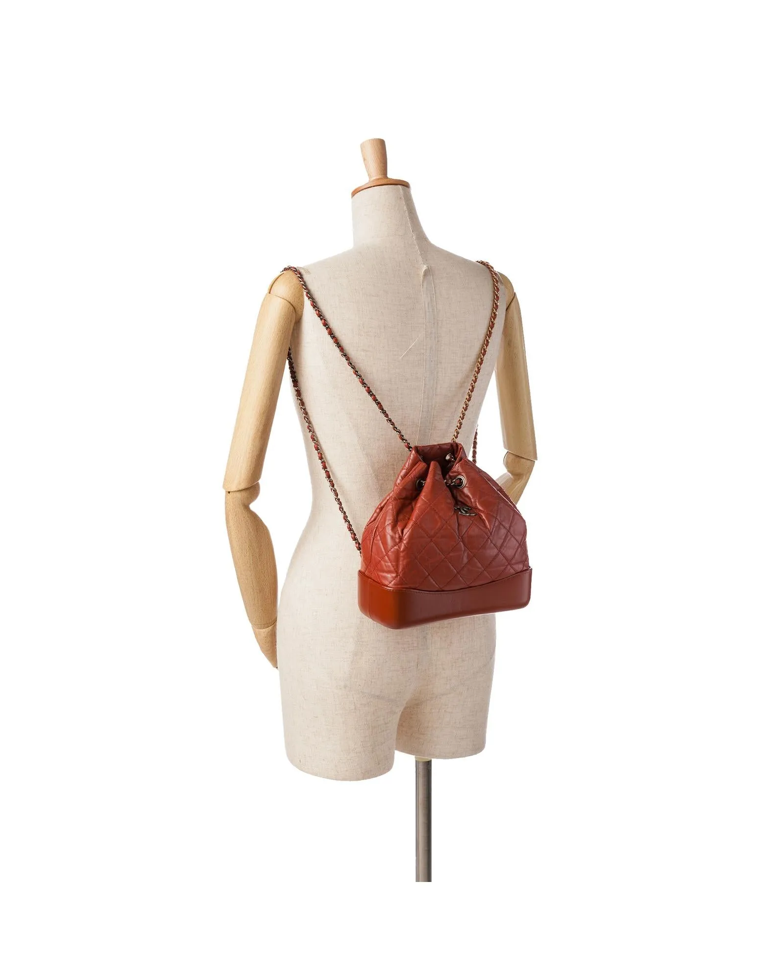 Aged Calfskin Leather Backpack with Chain Straps and Drawstring Closure