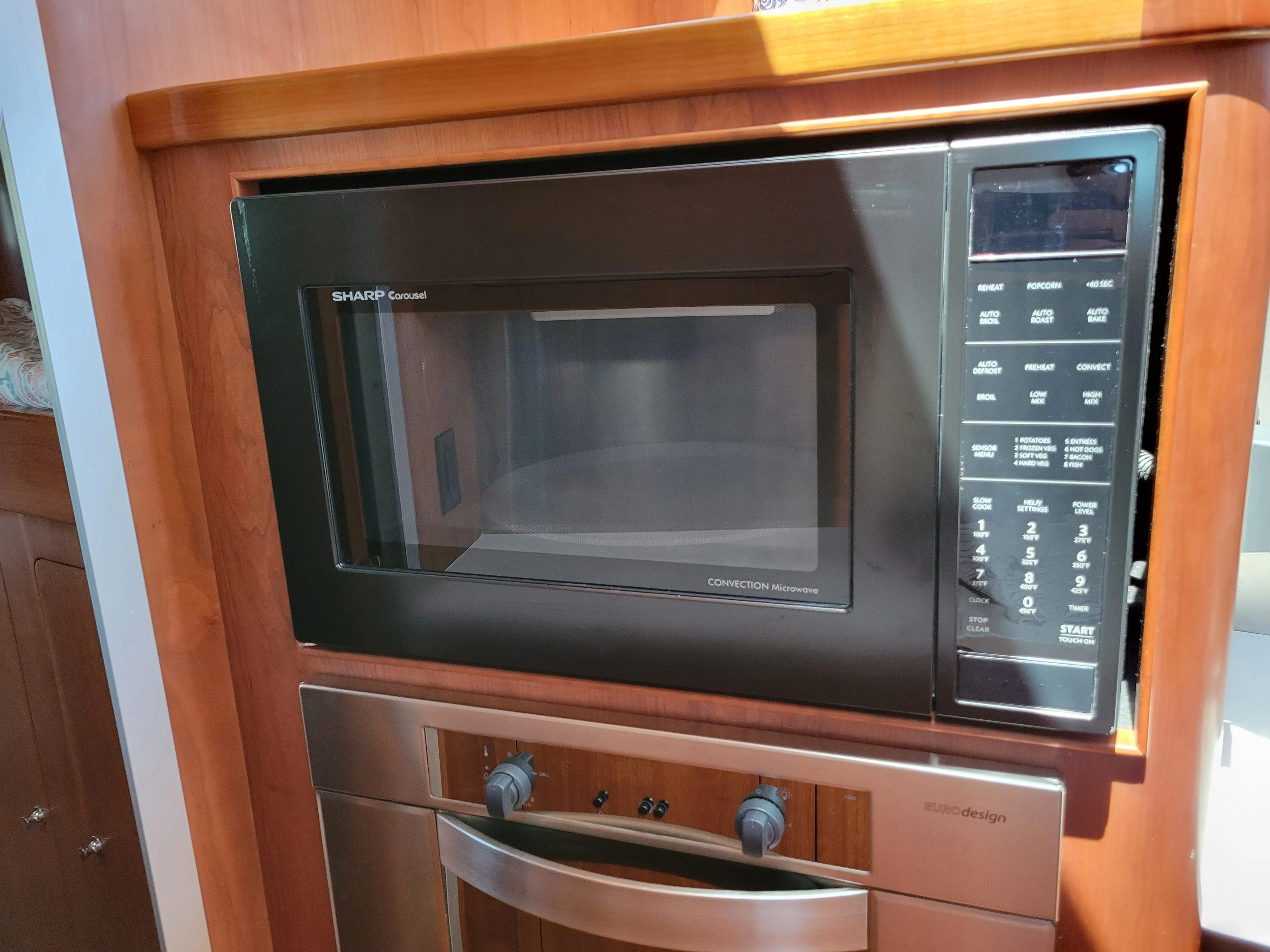 Sharp 1.5 cu. ft. 900W Sharp Matte Black Carousel Convection Microwave Oven (SMC1585BB)